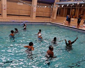 Women taking part in a UAA swimming session in the pool.